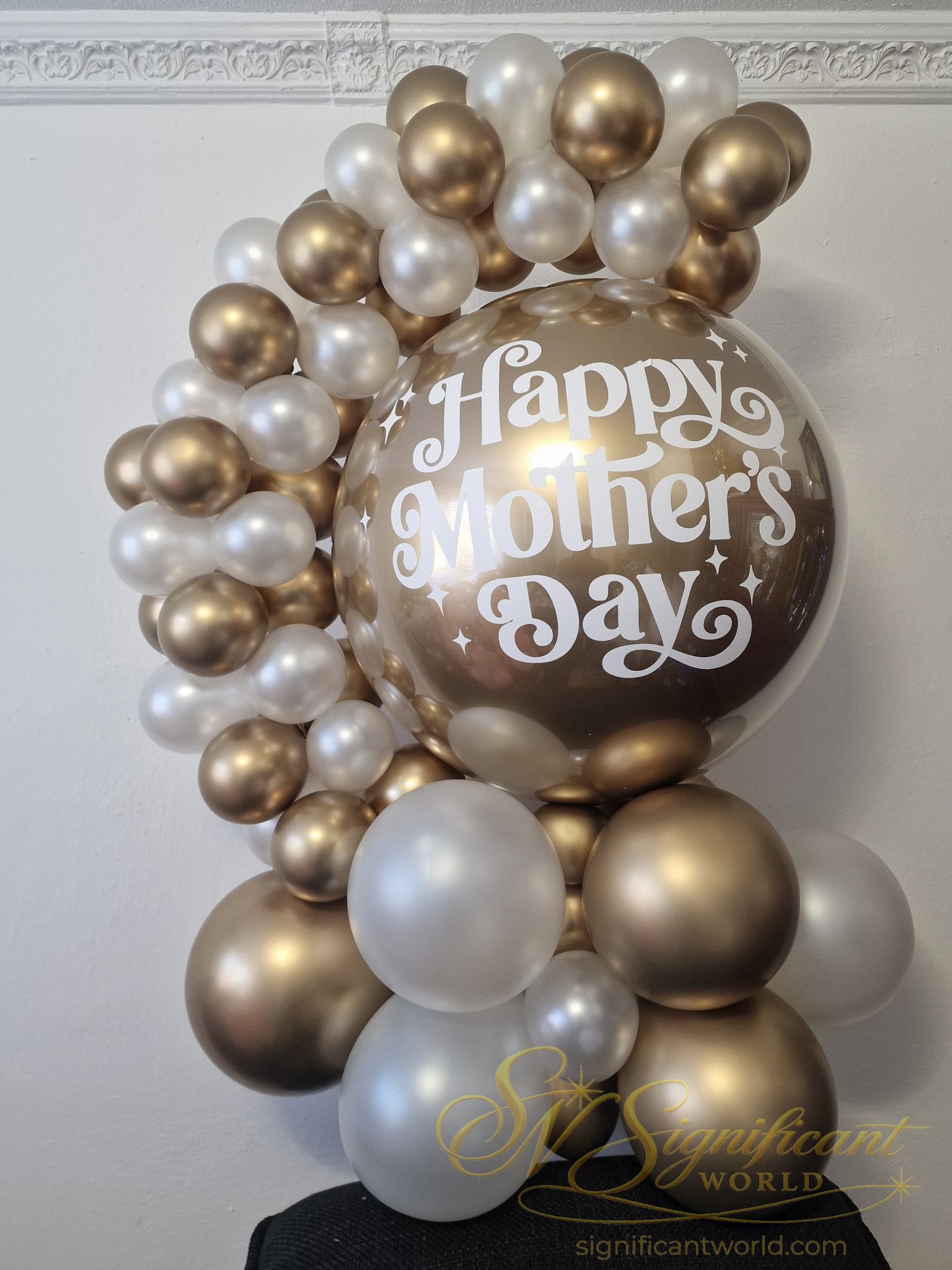 Bespoke bubble balloon with personalised gold vinyl lettering and handcrafted tassels by Significant World