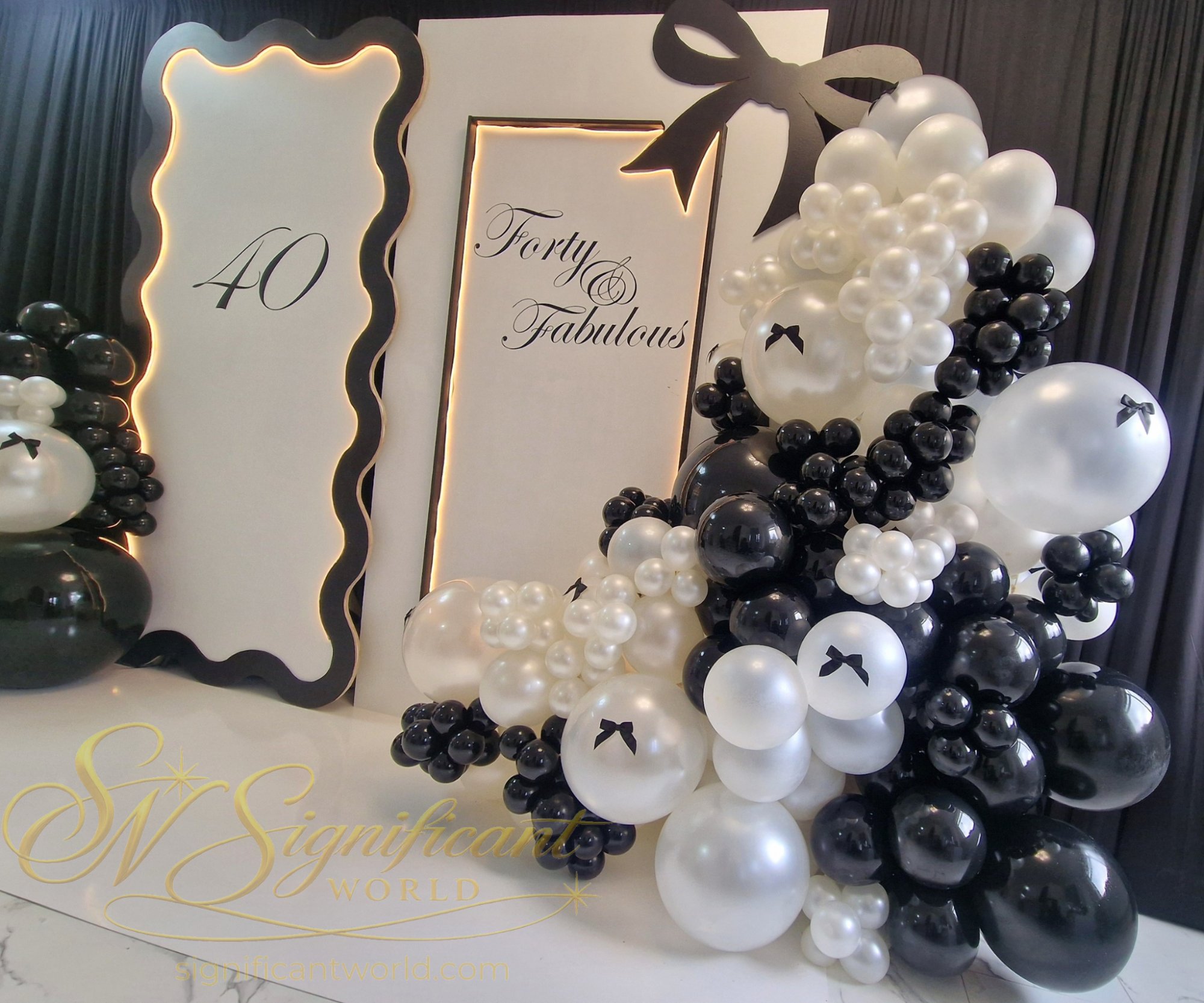 Luxury 40th birthday balloon garland with personalised Forty and Fabulous backdrop by Significant World Kettering